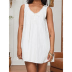 🔥 Meilleure vente | Robe mini trapèze blanche à col rond et volants smockés pour femme, style décontracté, idéale pour la plage ou les vacances.